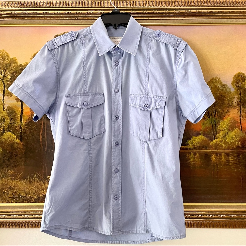 Light blue short sleeve button up shirt shoulder straps double covered pockets